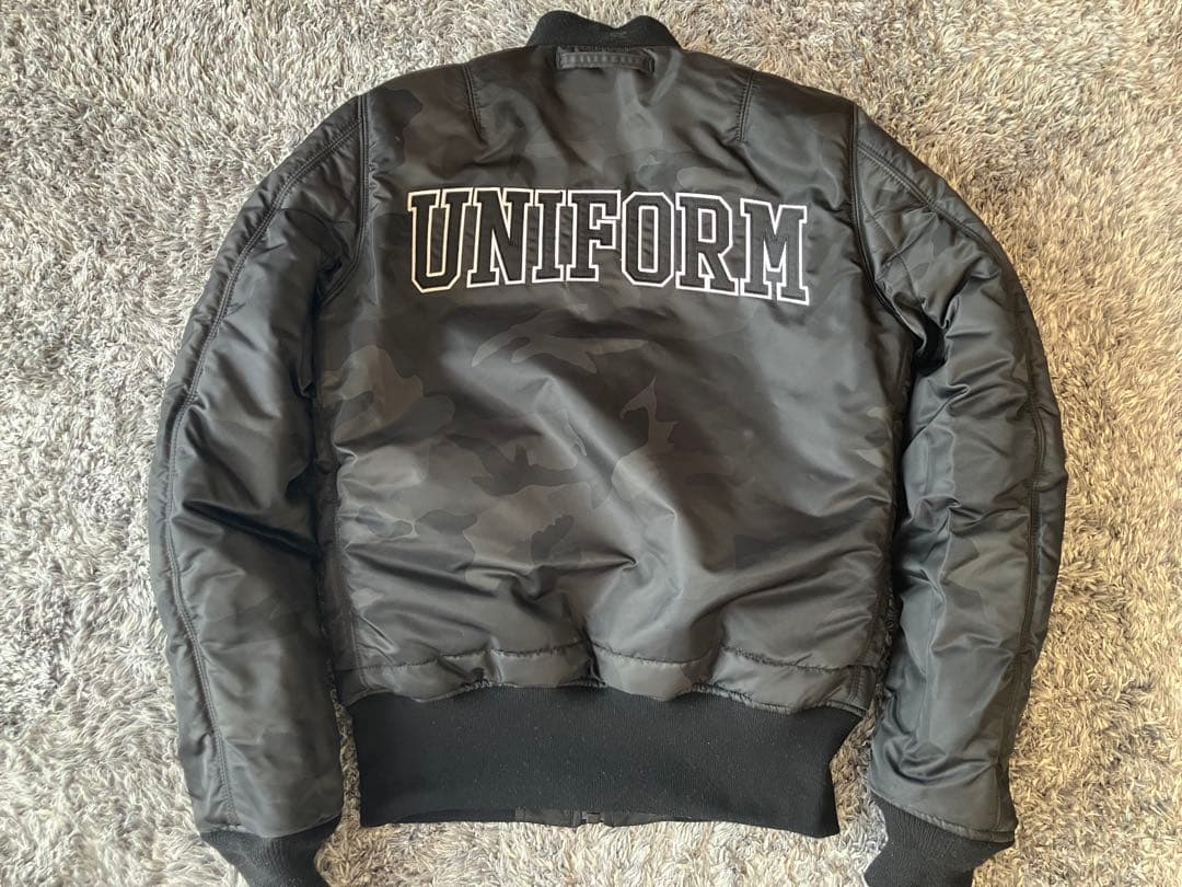 ジャケット・アウター UNIFORM EXPERIMENT ALPHA MA-1 GOODENOUGH