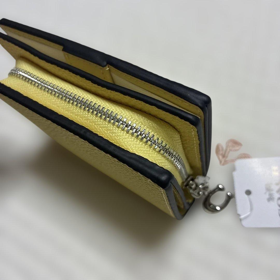【新品未開封】COACH コーチ 二つ折り財布　黄色　チャーリーブラウン