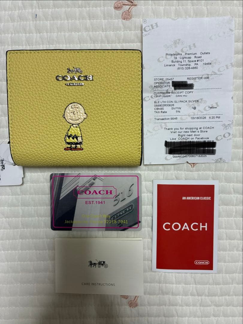 【新品未開封】COACH コーチ 二つ折り財布　黄色　チャーリーブラウン