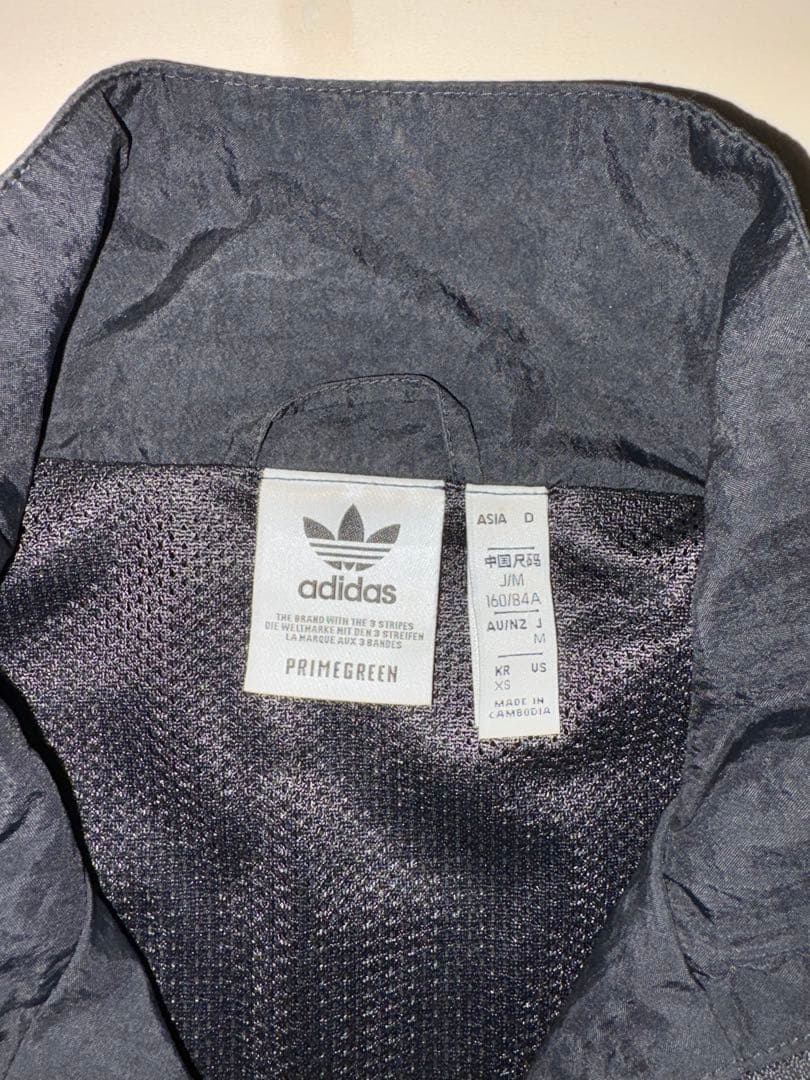 adidas アディカラークラシックス Disrupted アイコンセットアップ