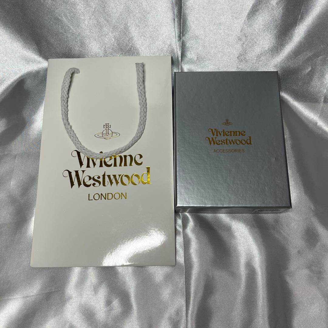 新品Vivienne Westwoodピーチ 蝶々留め 二つ折り財布 可愛い