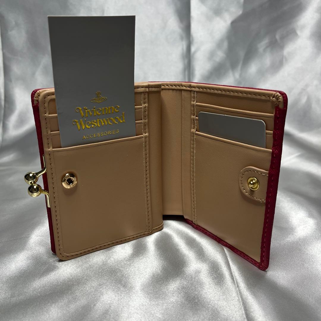 新品Vivienne Westwoodピーチ 蝶々留め 二つ折り財布 可愛い