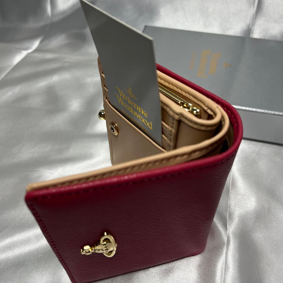 新品Vivienne Westwoodピーチ 蝶々留め 二つ折り財布 可愛い