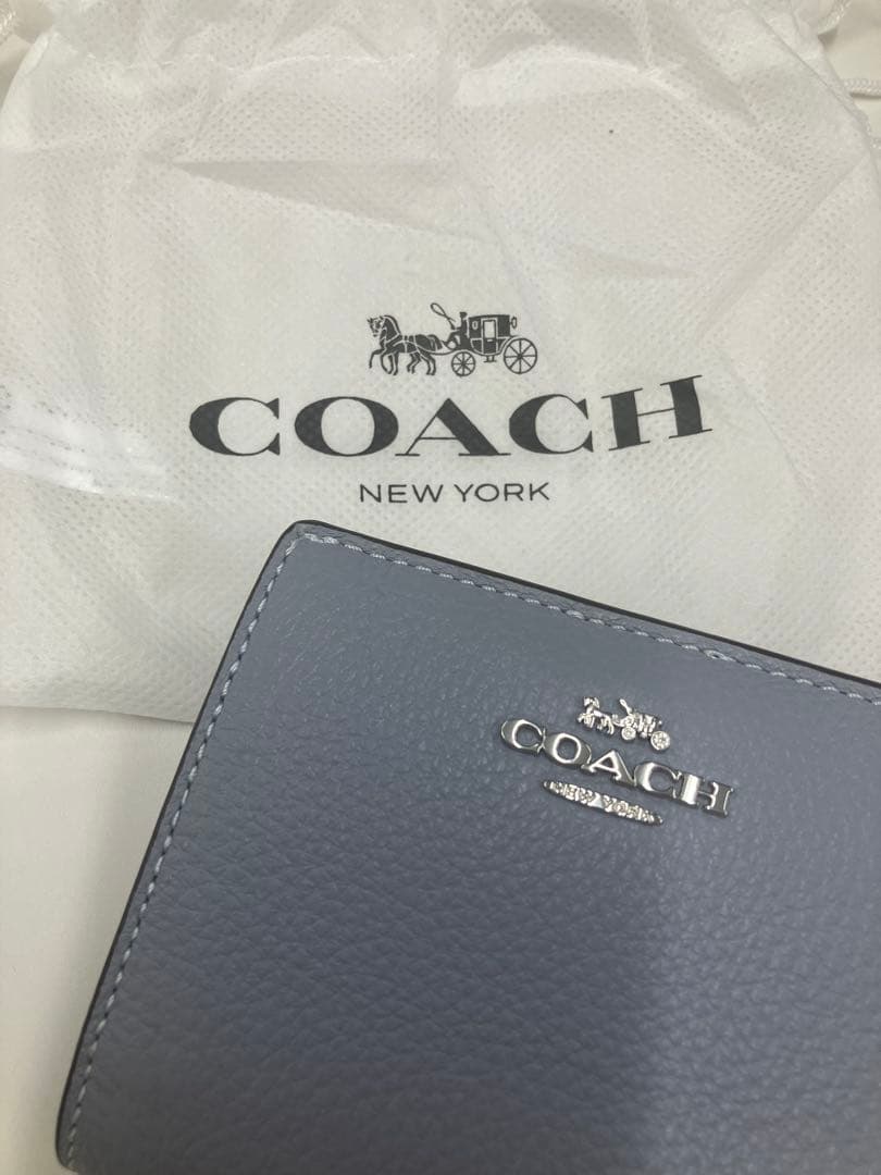 coach 二つ折り財布(空色)未使用品　袋付き