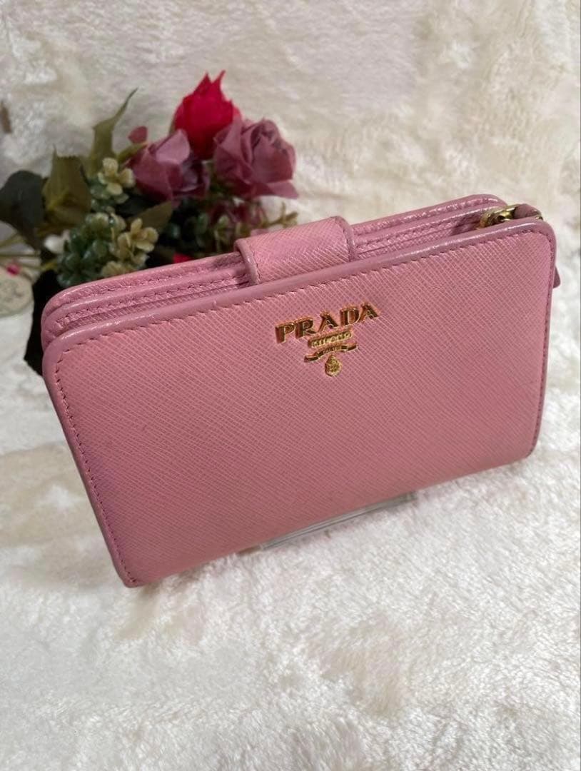 【人気】PRADA 二つ折り財布 ピンク ペオニアベルト サフィアーノ