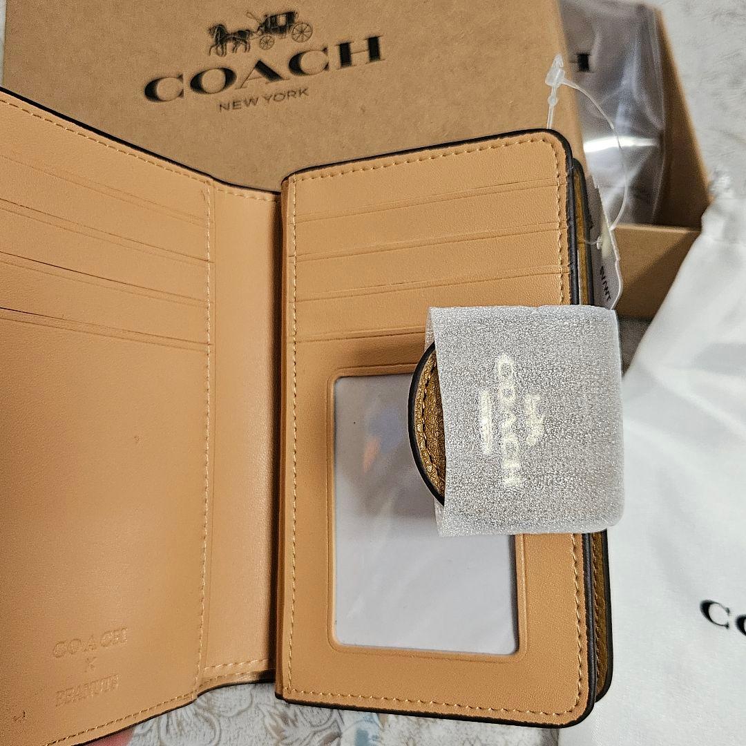COACH スヌーピー柄 二つ折り財布 新品未使用 保存袋、箱付