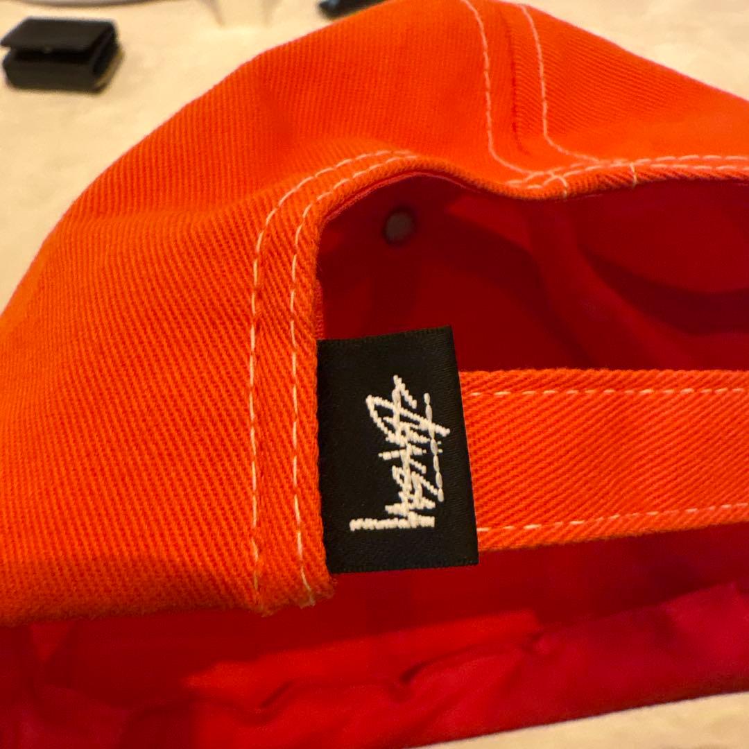 STUSSY オレンジキャップ