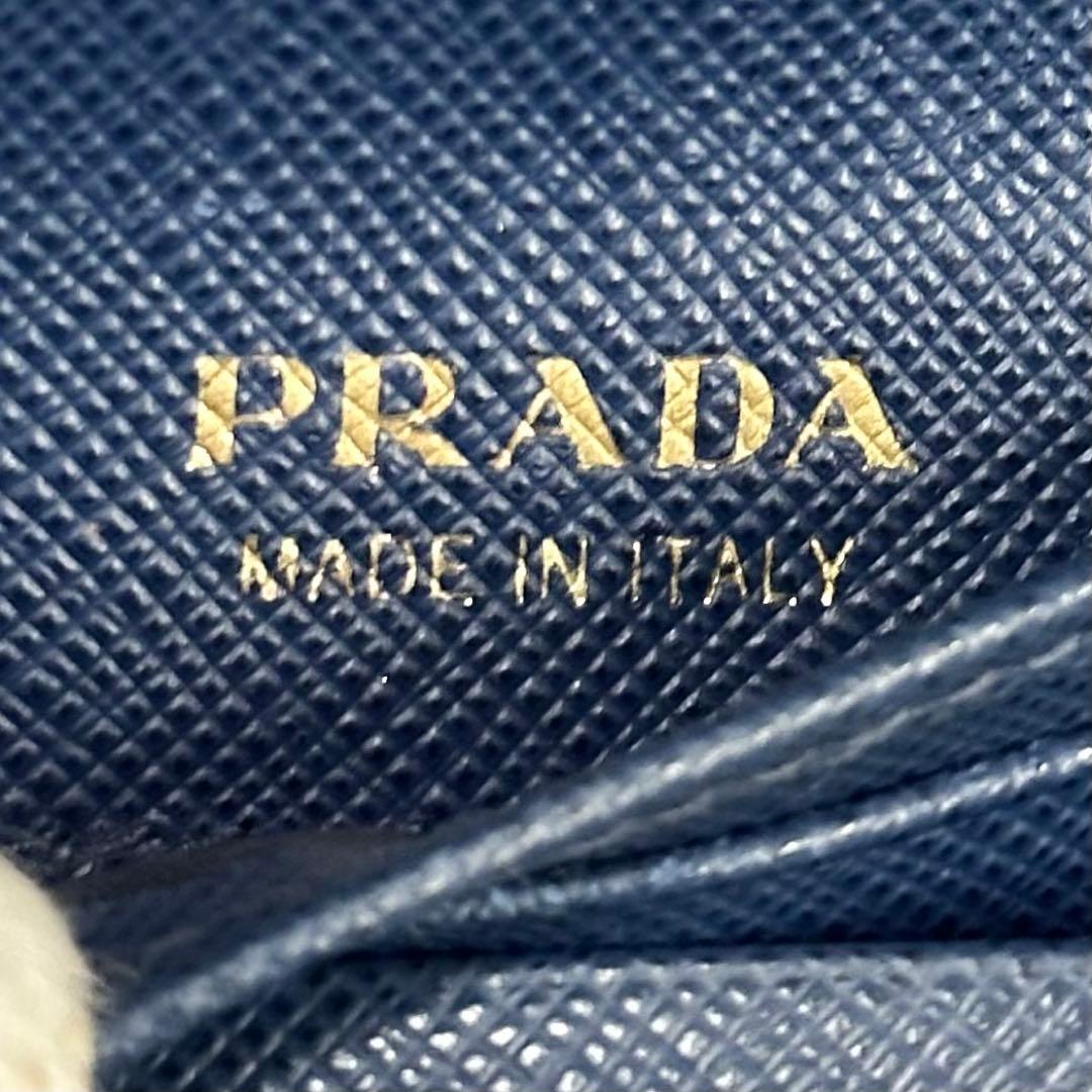 PRADA プラダ　折り財布　リボン　ゴールドロゴ ブルー　サフィアーノレザー