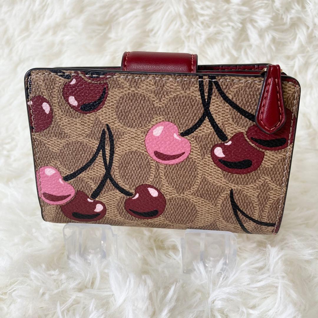 COACH コーチ シグネチャー チェリー柄 二つ折り財布
