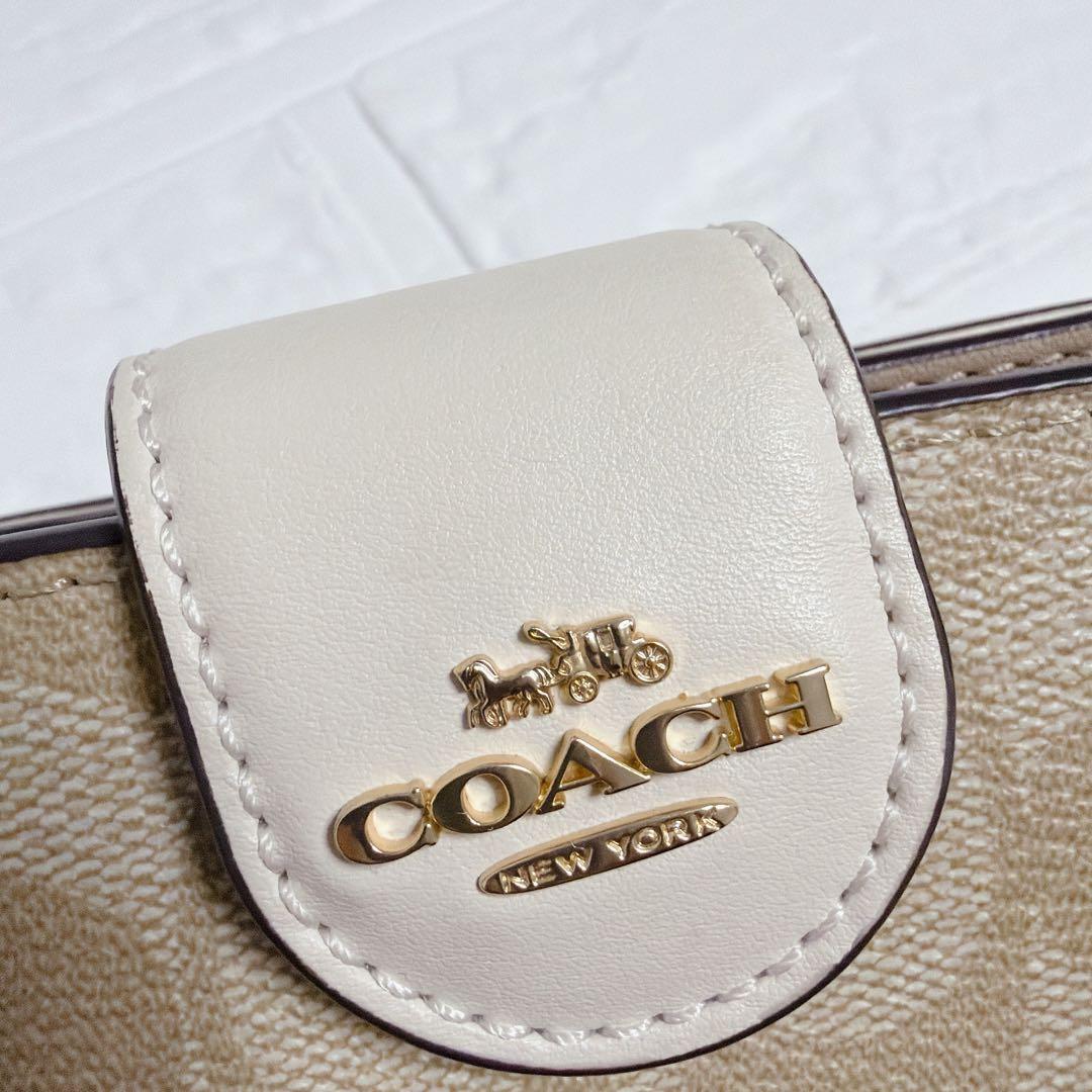 コーチ 二つ折り財布 シグネチャー ベージュ 白 coach