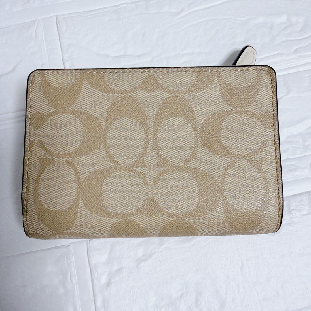 コーチ 二つ折り財布 シグネチャー ベージュ 白 coach