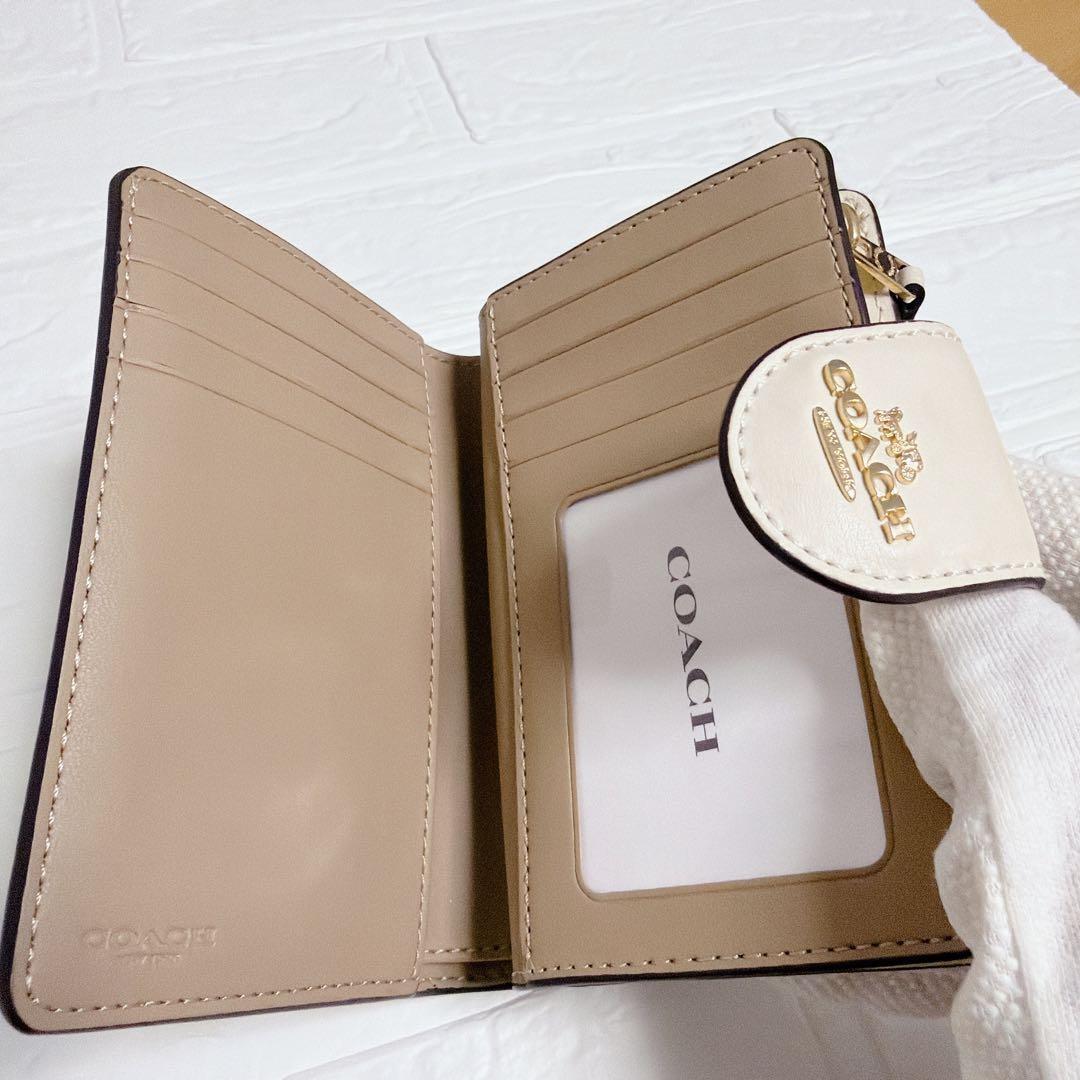 コーチ 二つ折り財布 シグネチャー ベージュ 白 coach