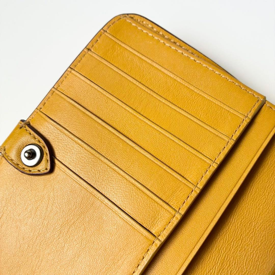 【極美品】COACH 二つ折り財布 ノマド グラブタンレザー 本革 マスタード