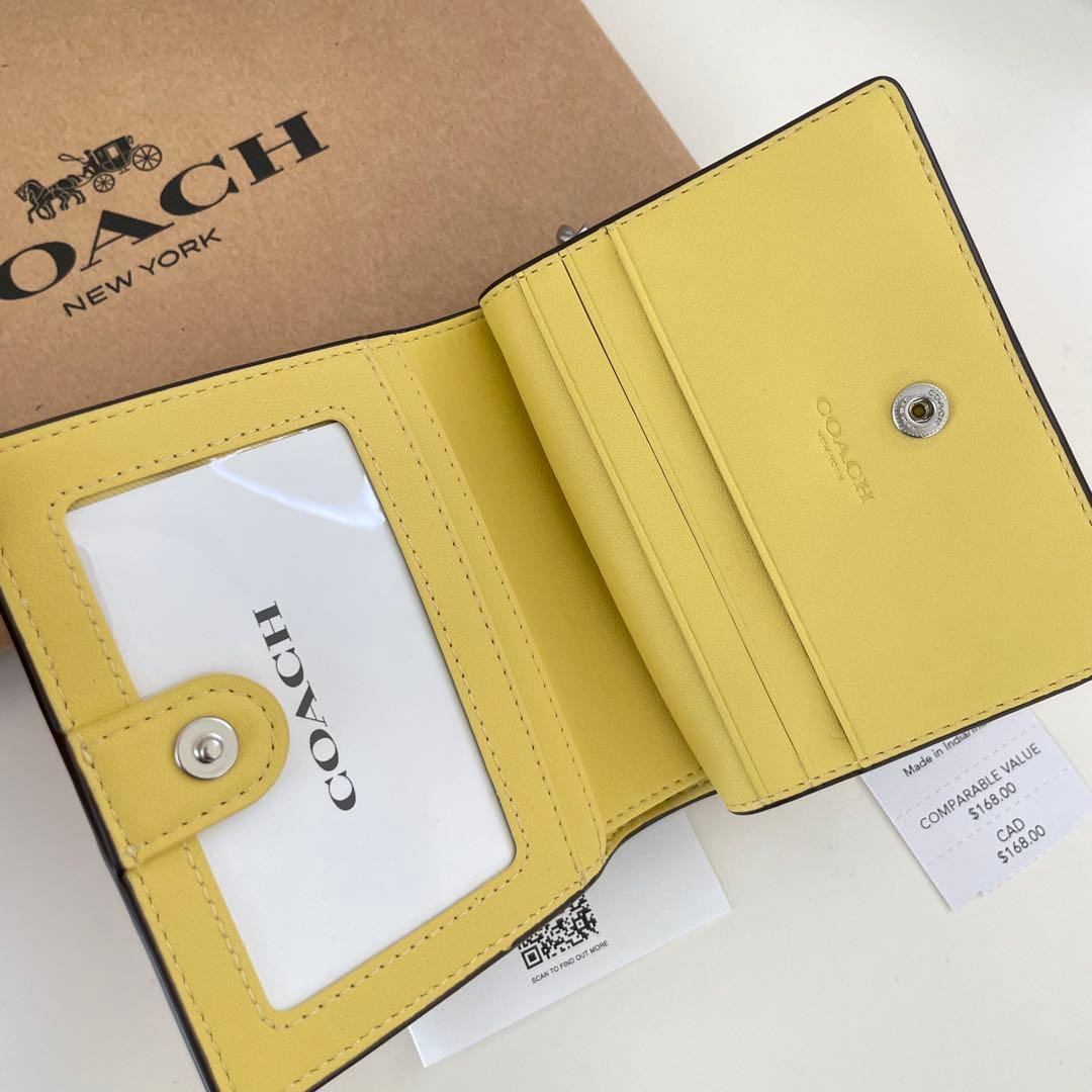 COACH コーチ　折り財布　イエロー　黄色　花柄　ミニウォレット