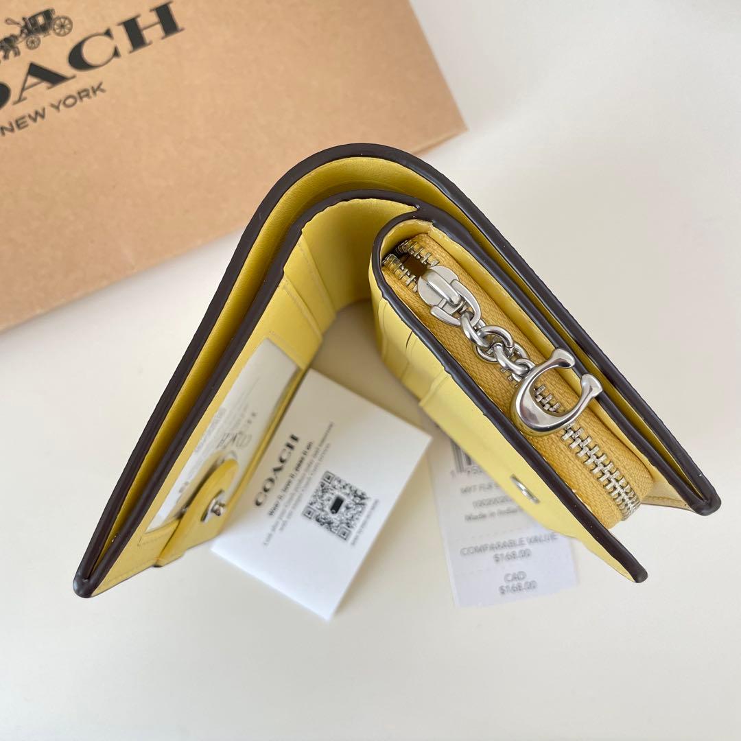 COACH コーチ　折り財布　イエロー　黄色　花柄　ミニウォレット