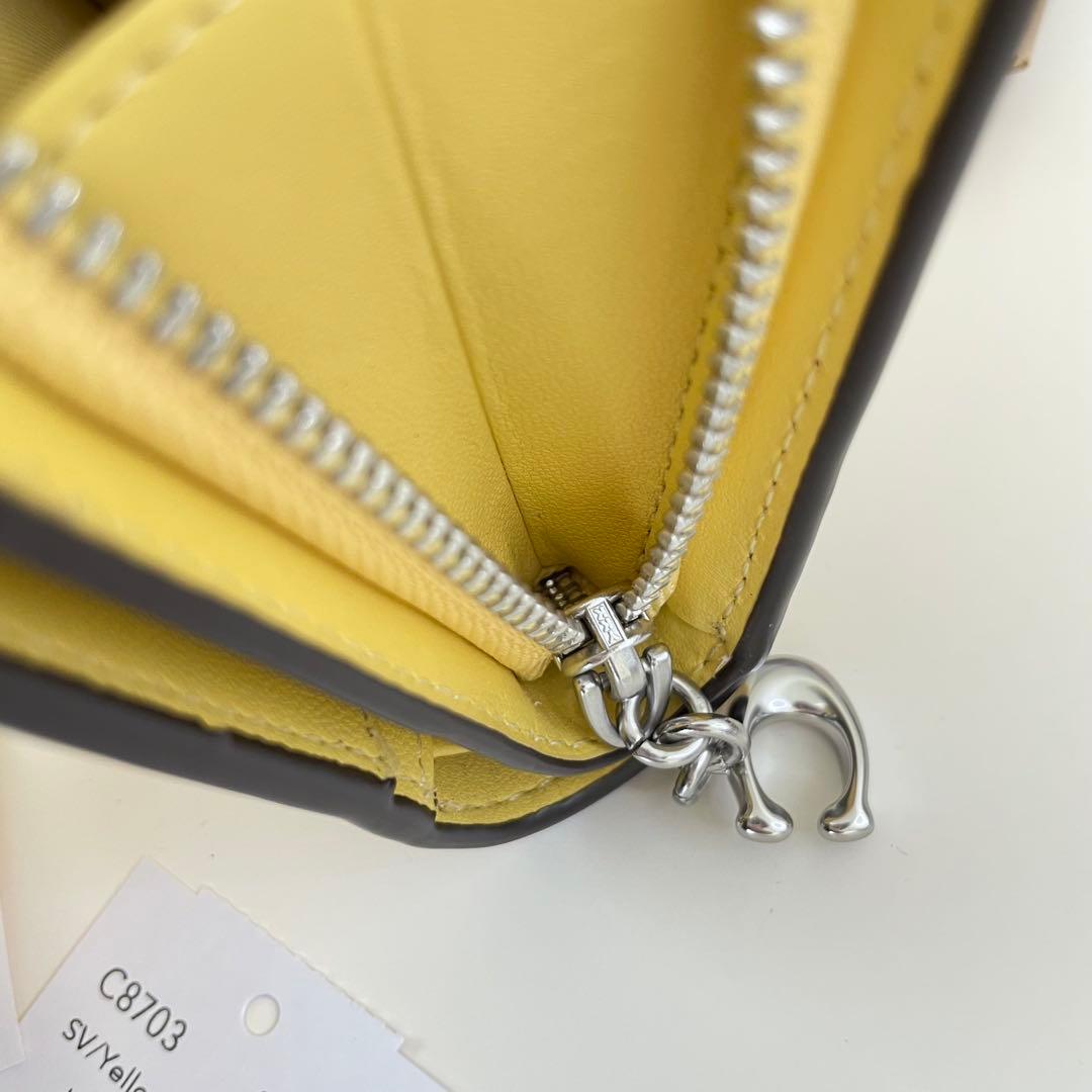 COACH コーチ　折り財布　イエロー　黄色　花柄　ミニウォレット