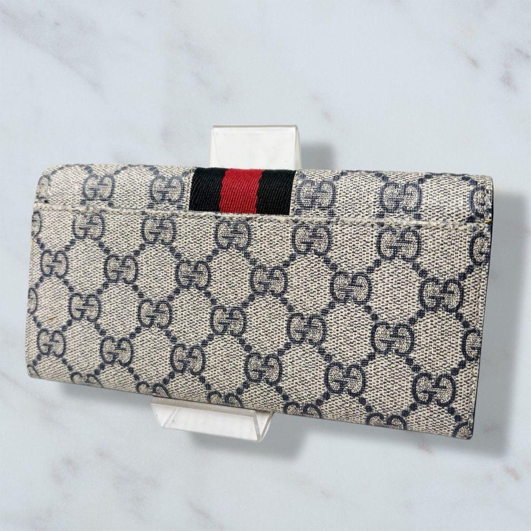 09 GUCCI PVC 二つ折り財布 長財布 シェリーライン k8