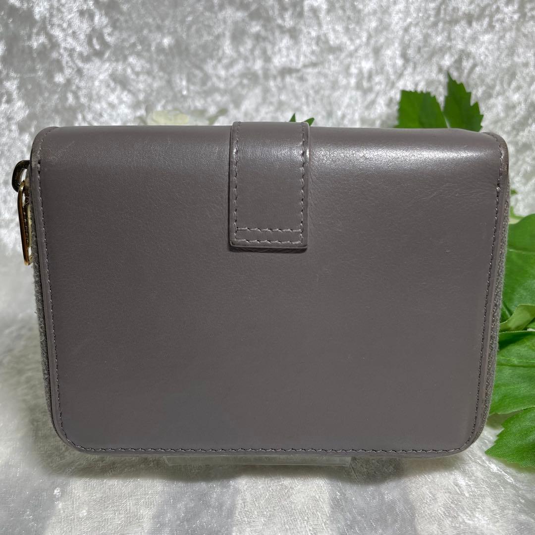 サンローラン 二つ折り財布 ラウンドジップ カサンドラ グレー YSL
