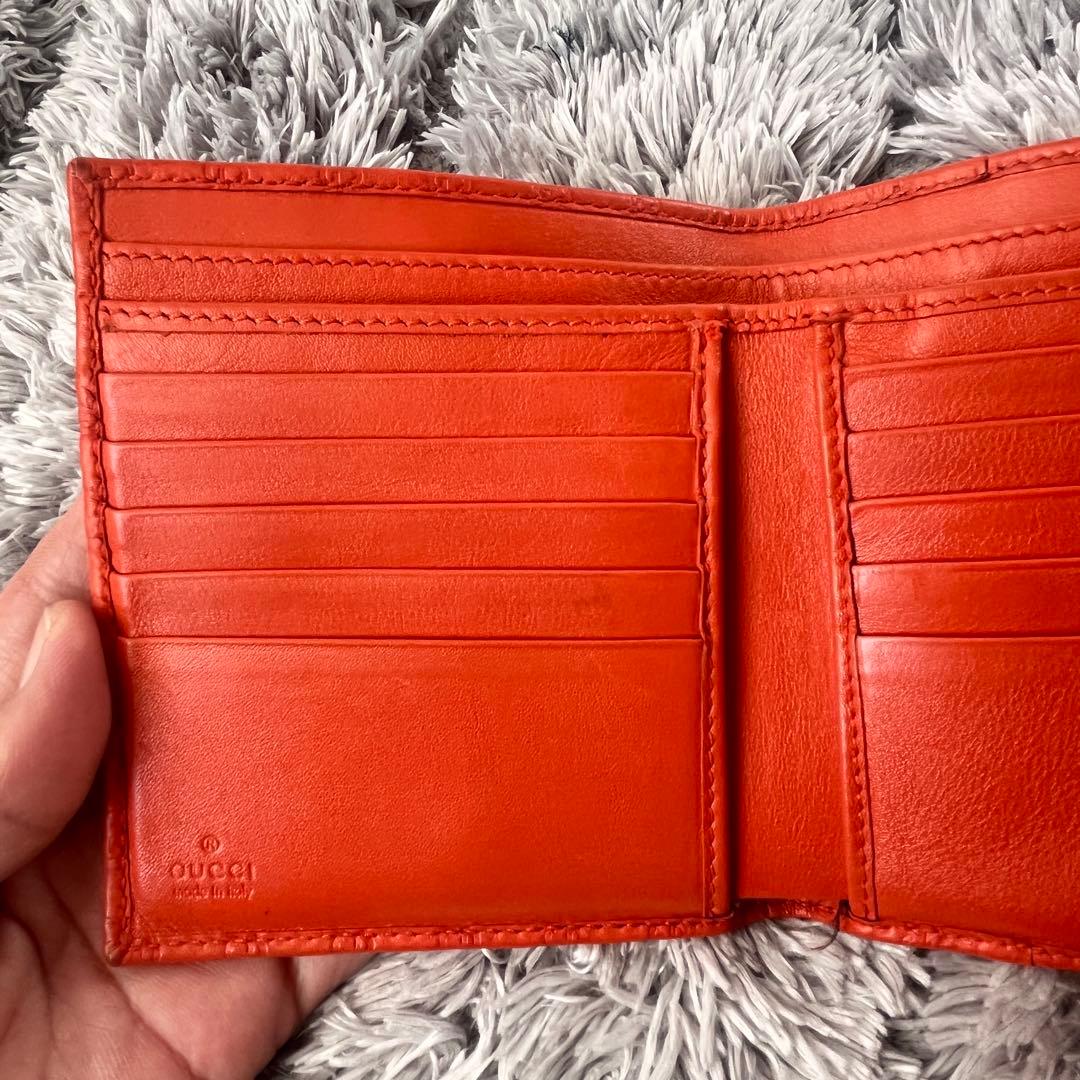 美品✨GUCCI マイクロシマ　折り財布　オレンジ　ロゴプレート　Wホック