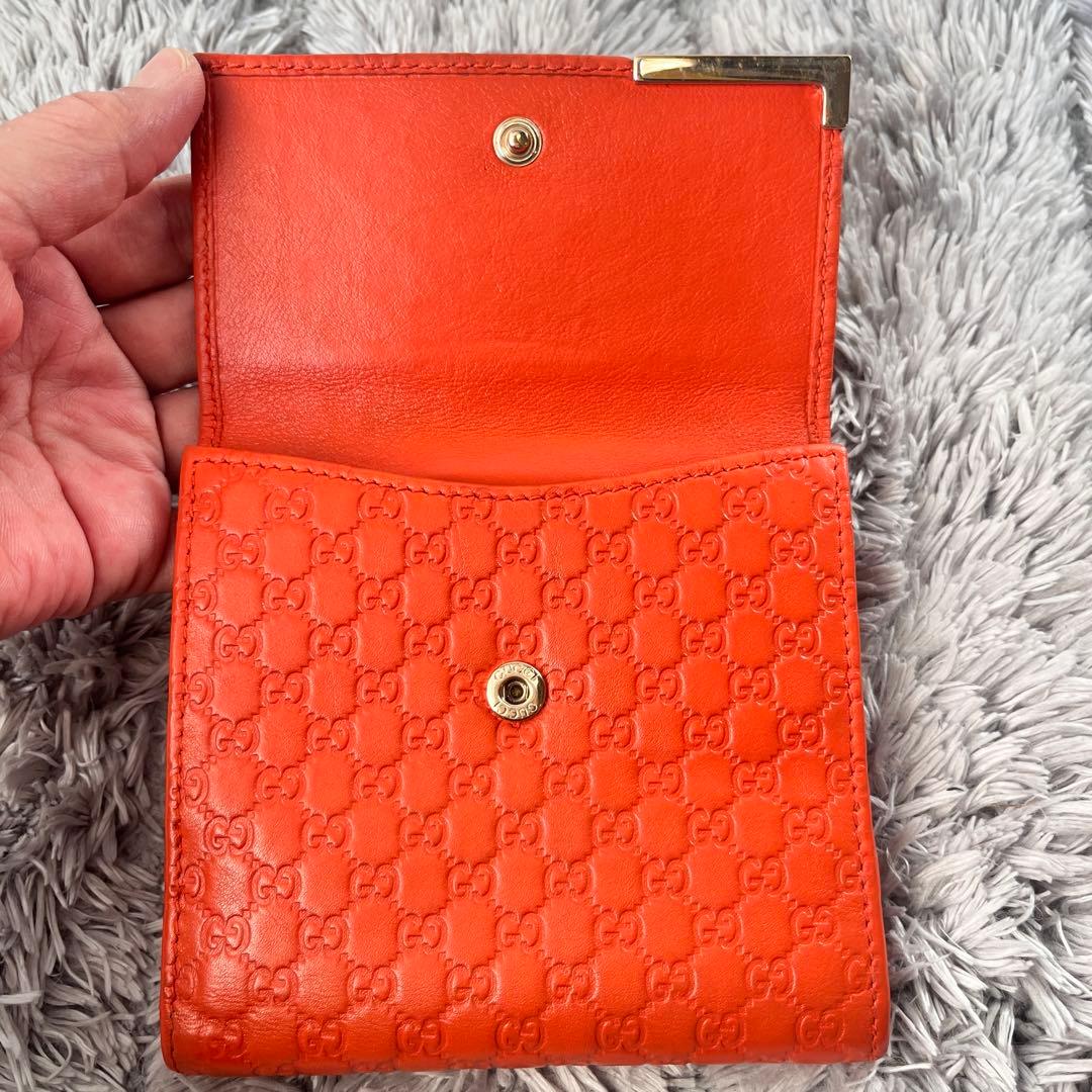 美品✨GUCCI マイクロシマ　折り財布　オレンジ　ロゴプレート　Wホック