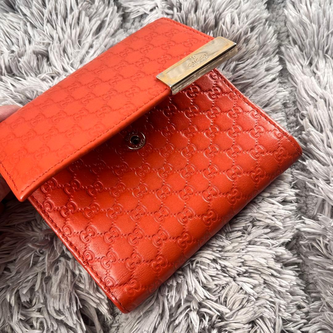 美品✨GUCCI マイクロシマ　折り財布　オレンジ　ロゴプレート　Wホック