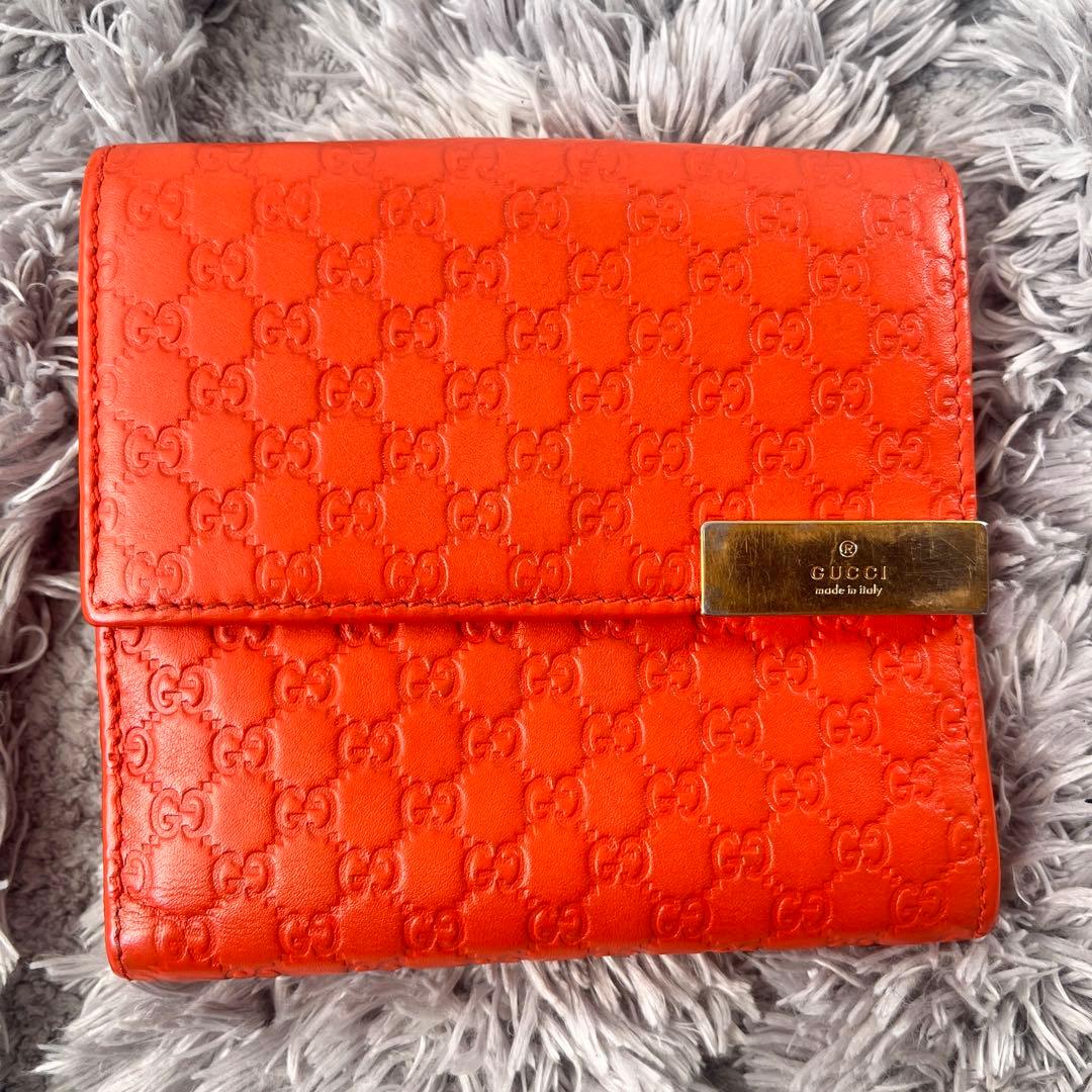 美品✨GUCCI マイクロシマ　折り財布　オレンジ　ロゴプレート　Wホック