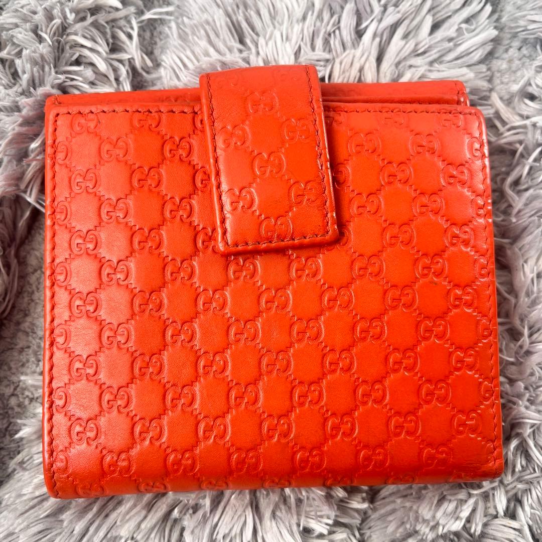 美品✨GUCCI マイクロシマ　折り財布　オレンジ　ロゴプレート　Wホック