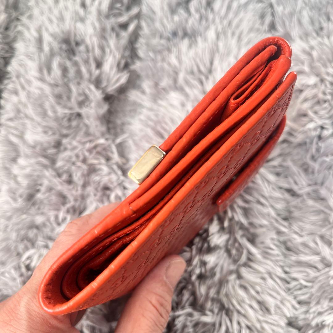 美品✨GUCCI マイクロシマ　折り財布　オレンジ　ロゴプレート　Wホック